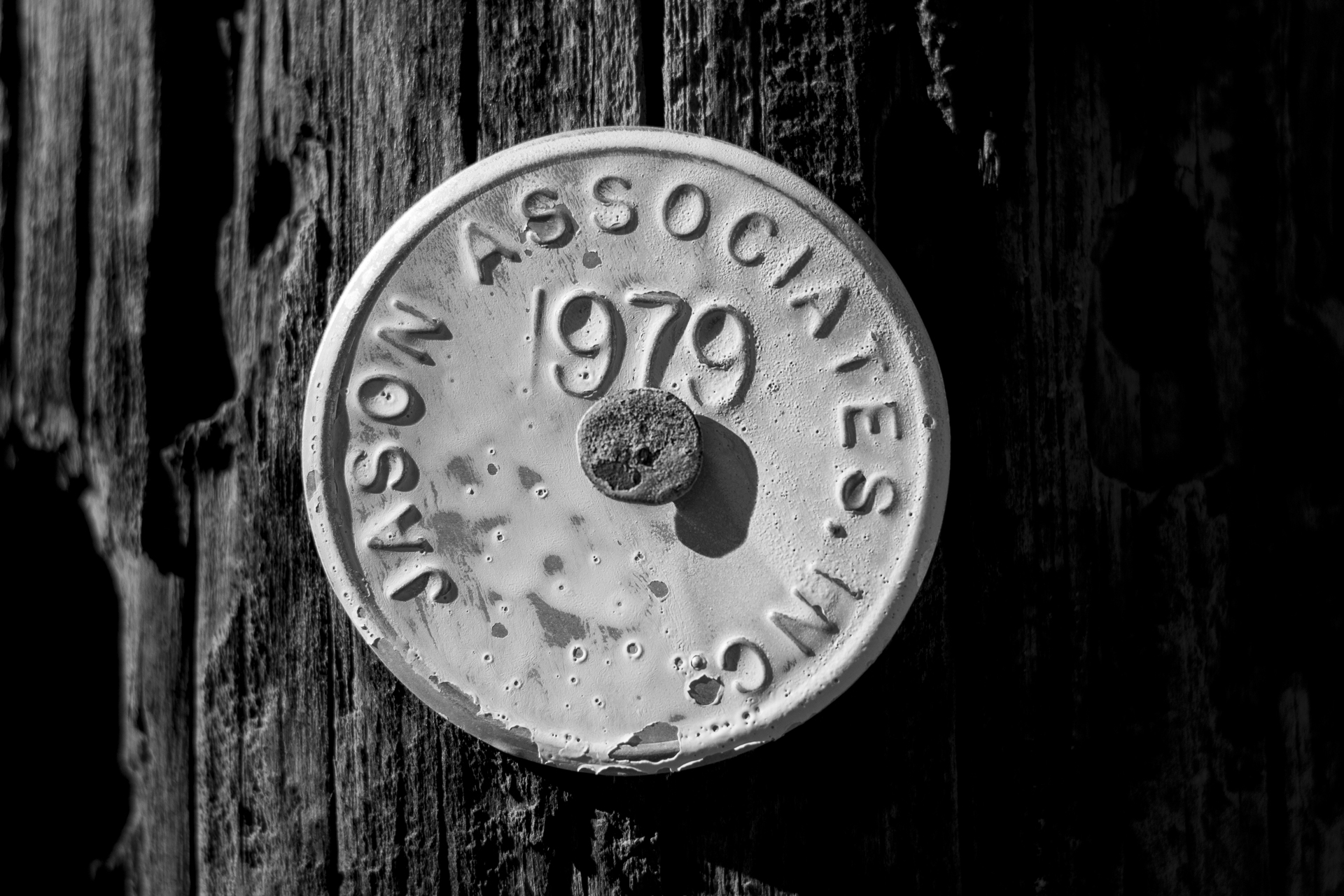 Tag posted on a wooden poll